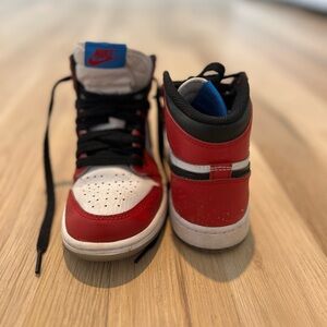 Kids red, black and white Nike Jordans